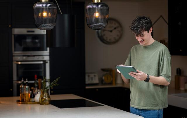 Male indoors using tech